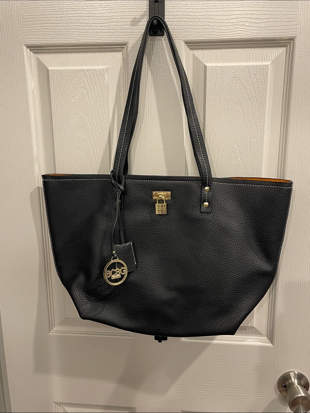 BCBG Paris Black Tote with Gold Hardware and Logo Charm unused
